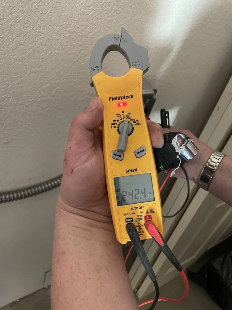 Voltage testing with clamp meter during Generator Installation in Fayetteville